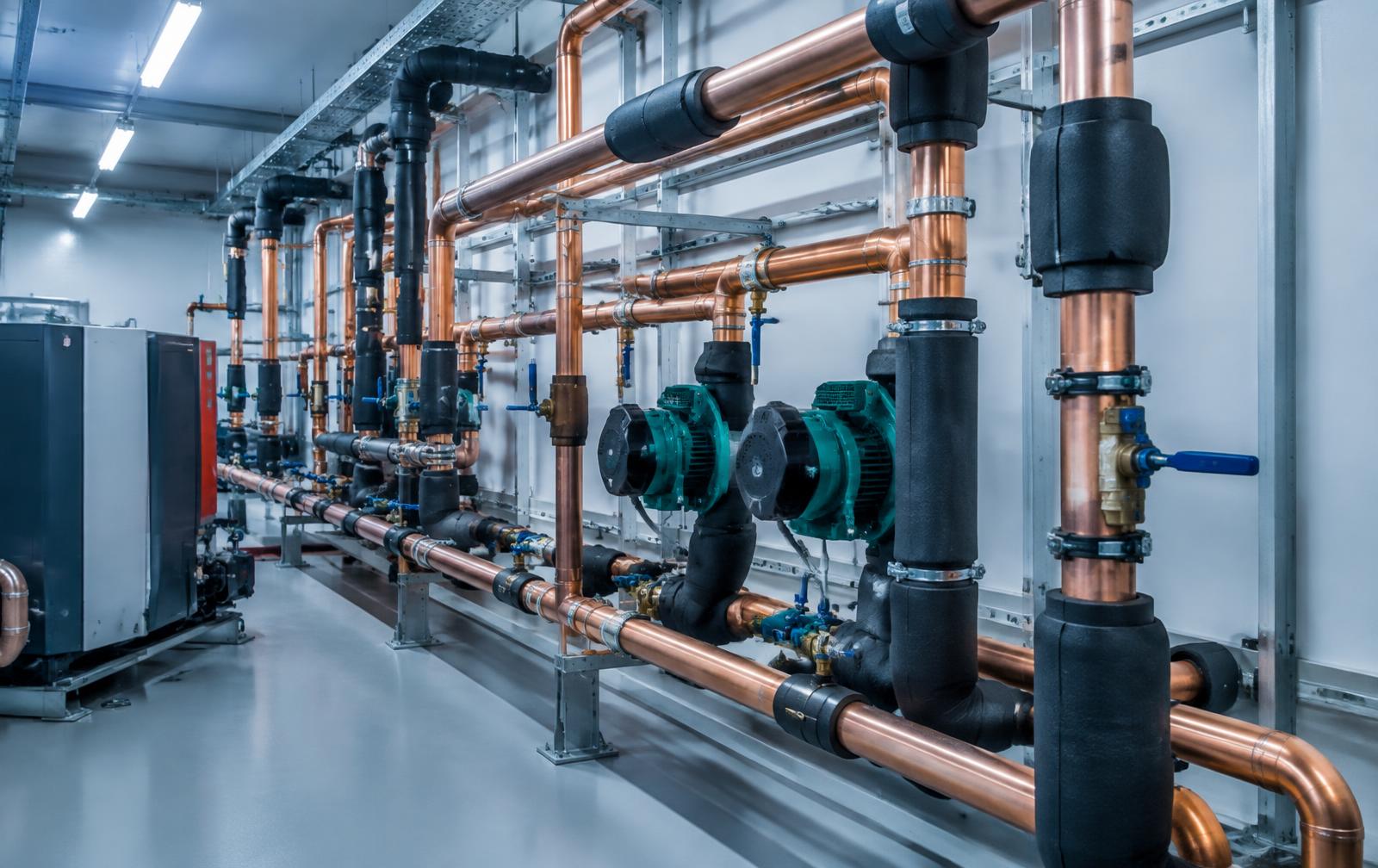 Insulated pipework in a plant room
